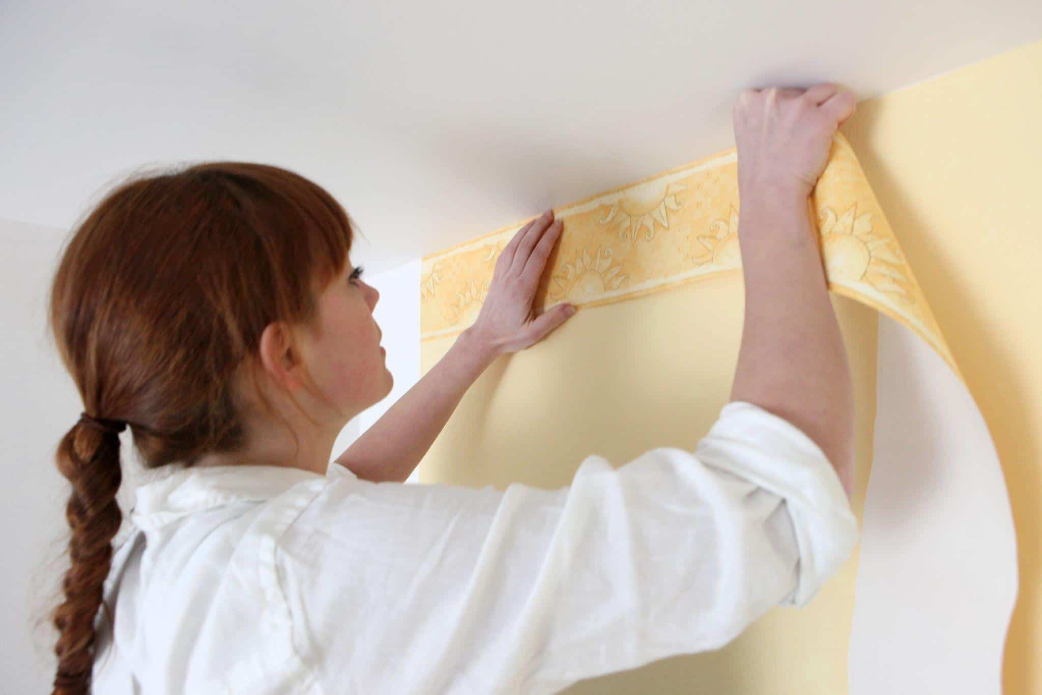Professional wallpaper installation close-up